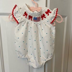 White and Blue Polka Dot Baby Romper with Red Accents